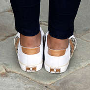 back of monogrammed snakeskin canvas sneakers