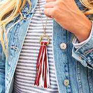 circle tassel necklace with striped shirt and jean jacket