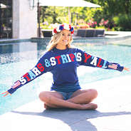 girl sitting by pool wearing navy stars and stripes y'all jersey