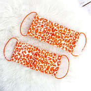 orange leopard face masks on rug