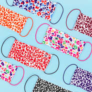 collage of multiple leopard face masks with dottie