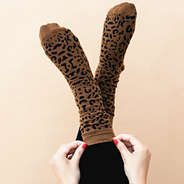 dark leopard socks on feet