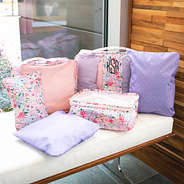 NEW coral floral packing bags on bench