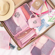 monogrammed packing bag set in pink seersucker