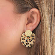 leopard statement earrings in ear