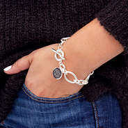 silver chain link bracelt with monogrammed disc