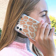 girl on phone with leopard glitter case