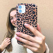 girl taking selfie with leopard case
