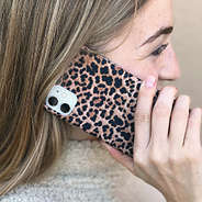 girl on phone with leopard case