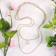 long beaded wrap necklace with monogrammed disc