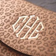 Brown Metallic Leopard monogrammed clutch on Detailed shot