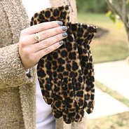 girl holding leopard gloves