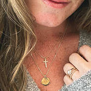 gold monogrammed cross necklace with sweater
