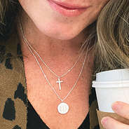 silver monogrammed cross necklace with leopard cardi