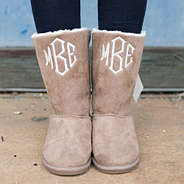 monogrammed sherpa suede booties with black leggings