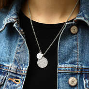 girl wearing monogrammed rhinestone pendant necklace with jean jacket