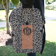 monogrammed dottie diaper backpack on arm