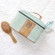 Green Dottie Train Case on White Fur Rug