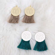 teal and mocha fringe disc earrings on faux fur