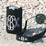 monogrammed black-scalloped koolie and sunglasses strap on the beach