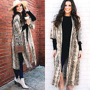 brunette in snakeskin kimono with boots and hat