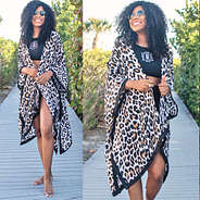 leopard cover up with high neck swim suit at beach