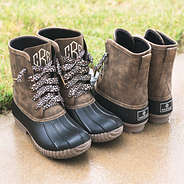 monogrammed leopard lace duck boots on wet pavement