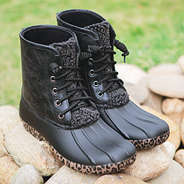 leopard duck boots on rocks