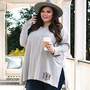 monogrammed oversized tunic with jeans and wide brim hat