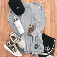 monogrammed dolman tunic with running shorts and leopard sneakers