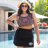 black monogrammed swim skirt with cheetah high neck bikini top