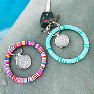 monogrammed beaded key rings at pool