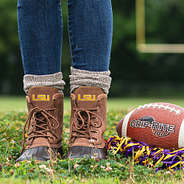 lsu duck boots on football field with pom pom