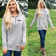 blonde wearing light gray quilted pullover with purple lsu logo