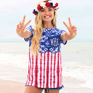 girl at ocean with monogrammed usa tie dye pocket t-shirt