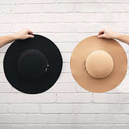 Wide Brim Felt Hat in Tan and black on white wall