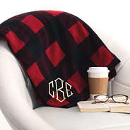 monogrammed buffalo plaid blanket on chair