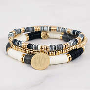 monogrammed stackable beaded bracelets on marble counter