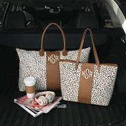 monogrammed spotted weekender with matching tote bag in back of car