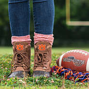 auburn duck boots with orange socks on football field