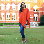 student wearing auburn poncho at william stamford hall