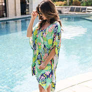 close up of monogrammed tropical palm swimsuit cover up