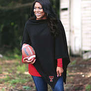 girl wearing texas tech poncho with football