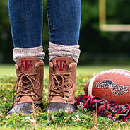 texas a&m duck boots on football field
