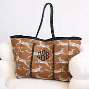 Monogrammed neoprene tote in Hickory Leaping Leopard on sherpa chair