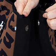 close up of magnetic closures on side