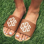 monogrammed brown slide sandals in grass