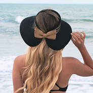 back of the black packable straw visor with bow
