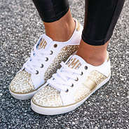 white, ivory, and gold metallic leopard sneakers