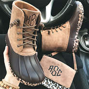 monogrammed leopard sole duck boots in car
